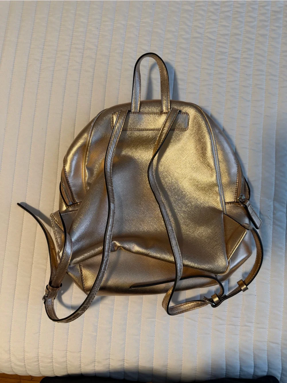 GUESS Metallic Gold Logo Backpack with Flower Charm